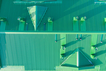 iron roof of the building and air ducts photo taken from a drone