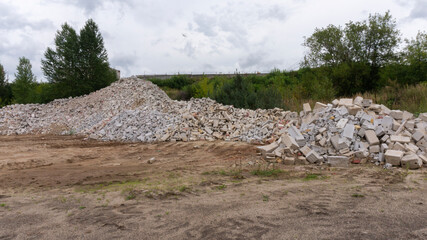 Pile of broken building bricks and blocks in outdoor nature