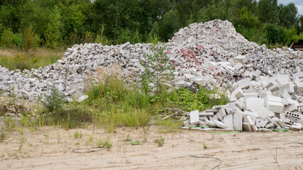 Pile of ruined building bricks and blocks in outdoor nature