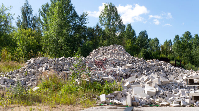 Landscape with pile of broken bricks and silicate blocks