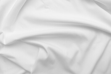 Obraz premium Abstract white fabric texture background. Cloth soft wave. Creases of satin. silk and cotton.