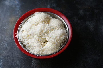 Idiyappam or String Hoppers Kerala breakfast food,  traditional steamed food, Indian food. Christian Christmas food. nool puttu, noolappam is a rice noodle  in  Tamil nadu India, Sri Lanka.