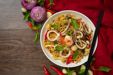 Thai food; stir-fried instant noodles with seafood and variety vegetable