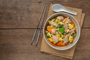 thai food;Sukiyaki pork on wooden table