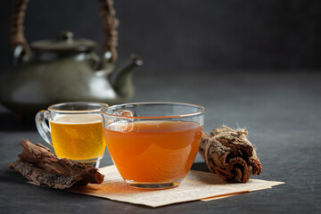 hot tea and bark on table