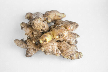 Pile of ginger root on white background
