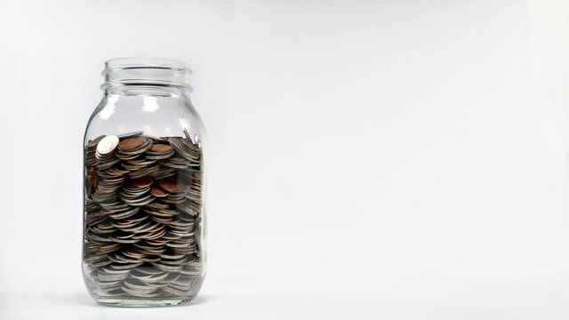 Coin in jar increasing - stop motion.