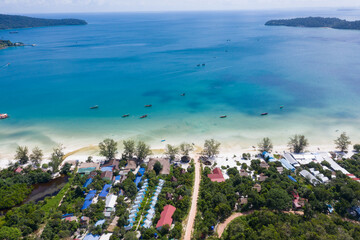 Long deserted beach with white sand and clear water. Aerial top view. island Koh Rong Samloem, Sihanoukville, Cambodia. This is a small island that attracts many vi. White sand beach and calm sea.