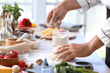 Obraz na płótnie Canvas Mature chef cooking in kitchen, closeup