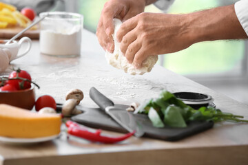 Obraz na płótnie Canvas Mature chef cooking in kitchen, closeup