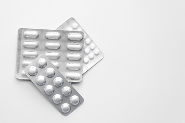 pack of pills lying on a white table