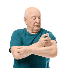 Senior diabetic man giving himself insulin injection on white background