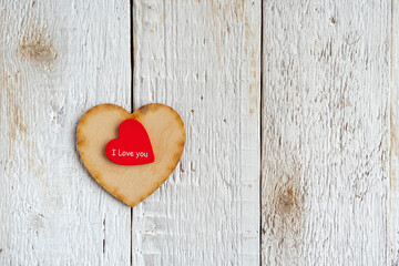 Heart on an old white wooden background. Copy space