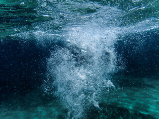 Bubbles under the sea in the crystal clear green sea water. Mediterranean bubbles. Real image very suitable for backgrounds