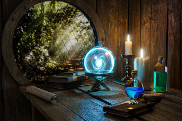 Spell book, Crystal mystic light ball, magic ring, magic potions bottles, burning candle and other various witchcraft accessories on the wizard table background. Alchemist  concept.