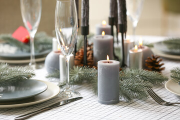 Beautiful table setting with Christmas decorations in living room, closeup