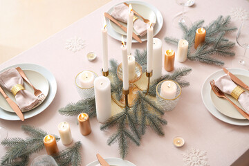 Fototapeta na wymiar Beautiful table setting with Christmas decorations in living room