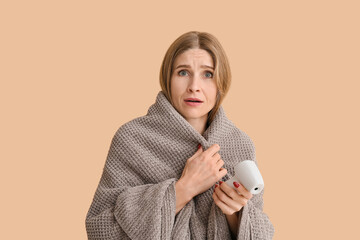 Ill woman with infrared thermometer on color background. Coronavirus epidemic