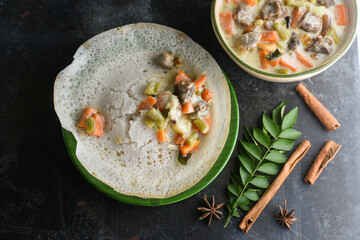 Mutton stew , chicken stew soup side dish for Appam , bread, Kerala breakfast food. Indian food. Christian Christmas food. spicy curry prepared with coconut milk, vegetables ,meat, Indian spices