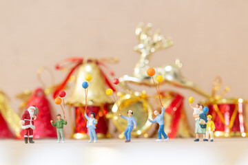 Miniature people, Happy family celebrating A Christmas  , Christmas and Happy New Year concept.