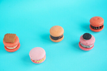 assortment colorful  korean macaroons on bright blue background