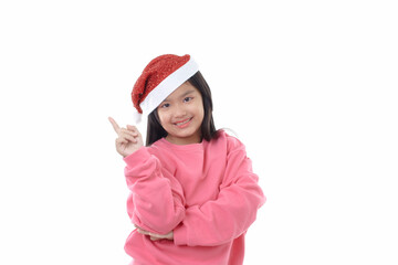 Asian little cute girl wearing Santa Claus cap