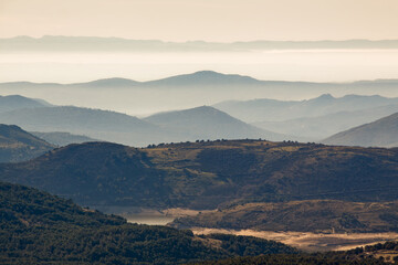 Panoramic of the Sierra de Avila, Skyline with fog at sunrise. Pico Cueva Valiente in Segovia and Madrid.