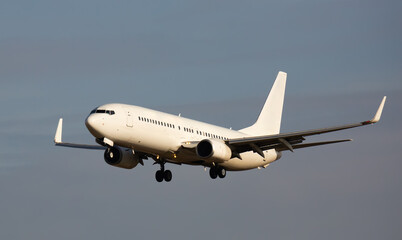 Image of passenger plane landing in airport afternoon at sunny day