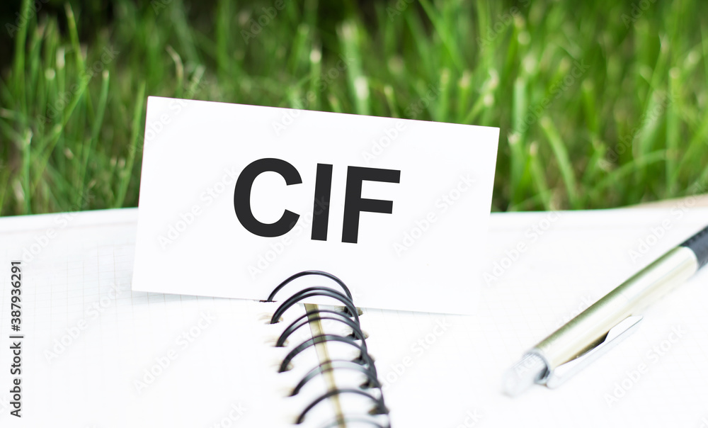 Poster business and finance concept. a card on which the text is written cif, which lies on an open noteboo