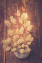 Vase of dried soft autumn flowers. Rabbit Tail Grass. vintage foto