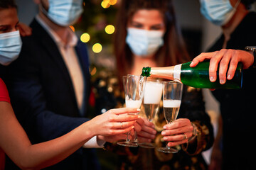 Two beautiful young couples having fun at New Year's Eve Party