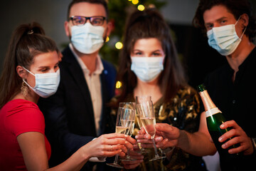 Two beautiful young couples having fun at New Year's Eve Party
