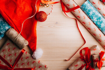 new year gifts and decorations on wooden background and place for text.