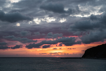 Black sea sunset in thunderclouds