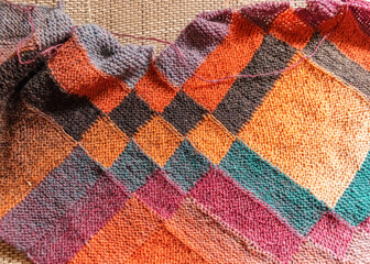 entrelak style knitted colorful scarf, wool threads, knitted texture