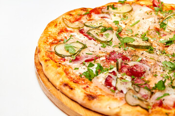 Fresh pizza pickles, bacon, sausages and cheese on a wooden board. Close-up, selective focus