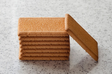 Rectangular shortbread cookies on a light marble top. Homemade baking.