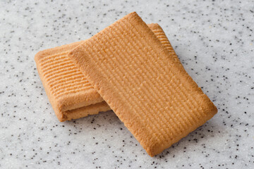 Rectangular shortbread cookies on a light marble top. Homemade baking.