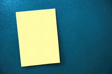 Blank empty yellow sticky paper sign mock up on a metal surface background