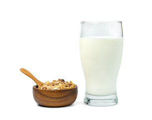 milk in transparent glass and muesli multi fruit in wooden bowl and spoon isolated on white background ,include clipping path