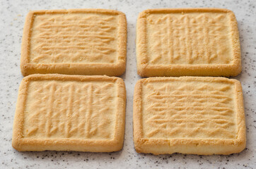 Rectangular shortbread cookies on a light marble top. Homemade baking.