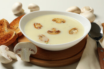Concept of tasty lunch with bowl of mushroom soup, close up
