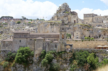 Fototapeta premium Rupestrian church along the canyon carved by the Gravina River where lies Matera, Basilicata, Italy