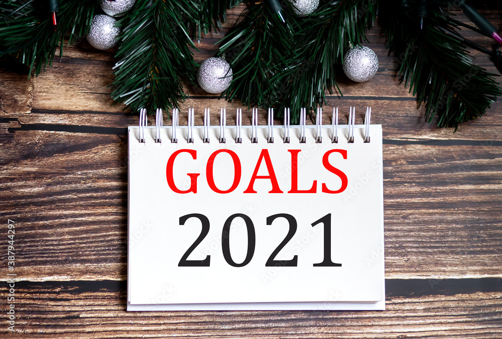 Poster goals 2021 christmas tree concept text words on notepad