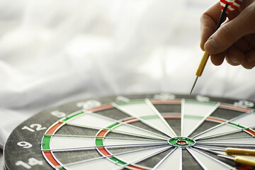 Darts. The dart for playing in the game board is stuck. Hit the sector in darts. The concept of a...