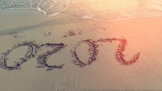 The Inscription On The Sand 2020 With Ocean Wave. The End Of The Terrible Year Caused Coronavirus