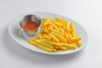 A serving of french fries with tomato sauce. Fast food, junk food concept.