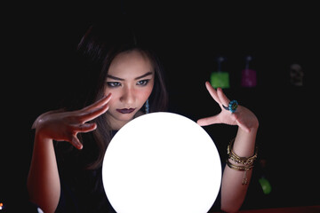 Fortune teller forecast future using crystal ball.