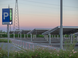 Fototapeta na wymiar renewable energies public parking with photovoltaic panels used as roofing