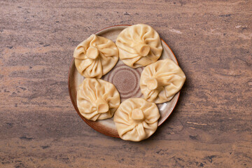 Traditional Georgian khinkali, selective focus, top view. Flat lay of Georgian cuisine. Copy space banner.